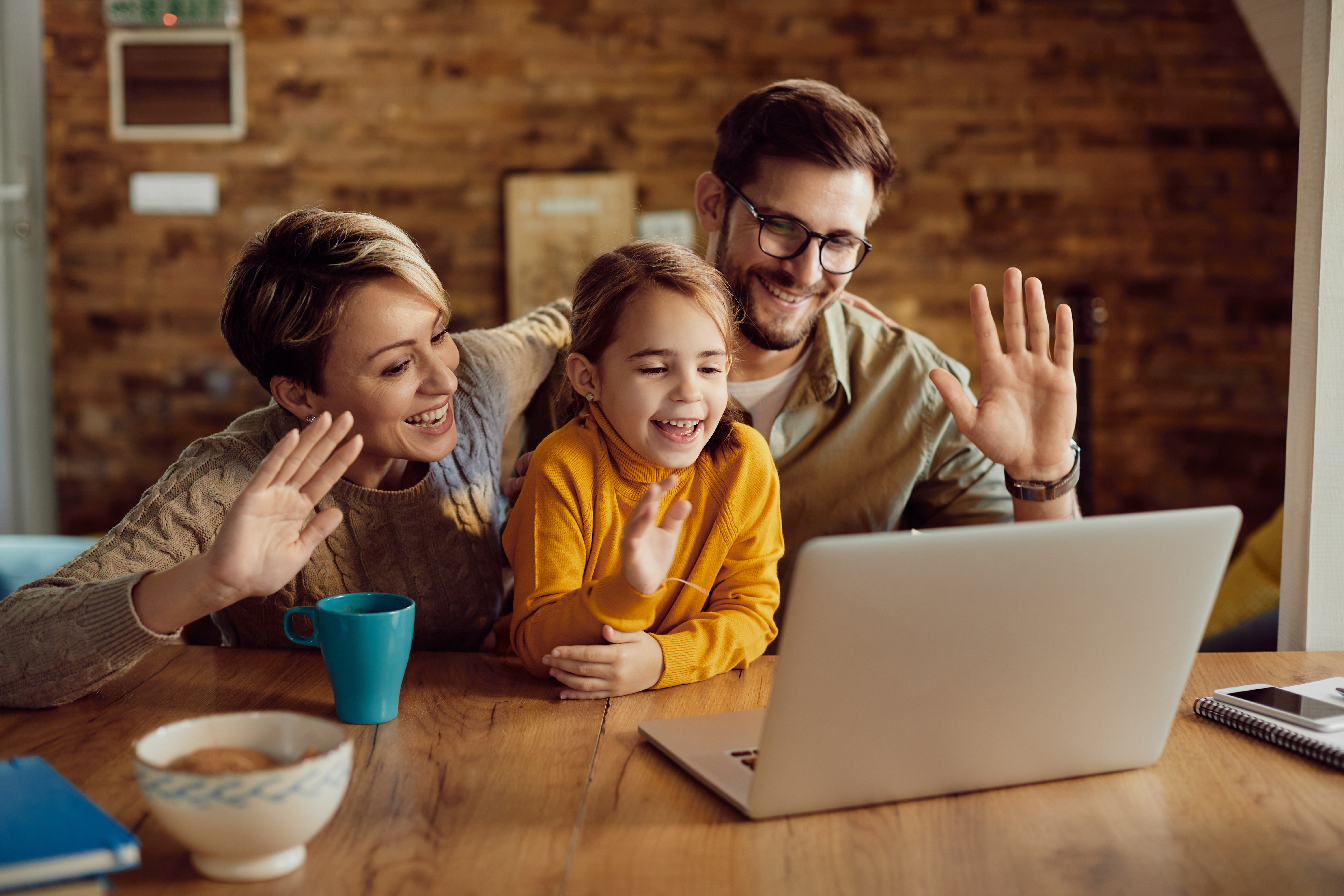 happy-family-waving-video-call-home